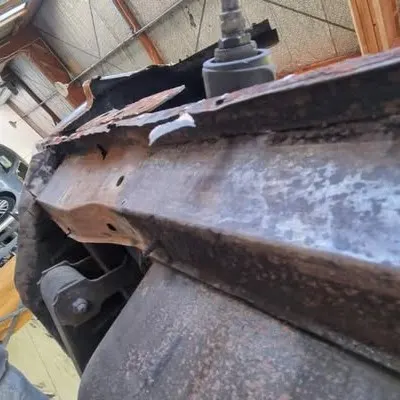 Corroded chassis rail on the 1965 Mustang, exposed during the strip-down