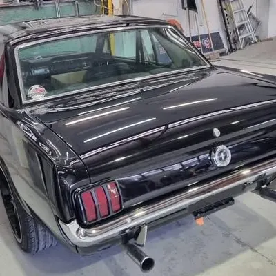 Rear of the finished Mustang with the workshop reflected in the boot lid